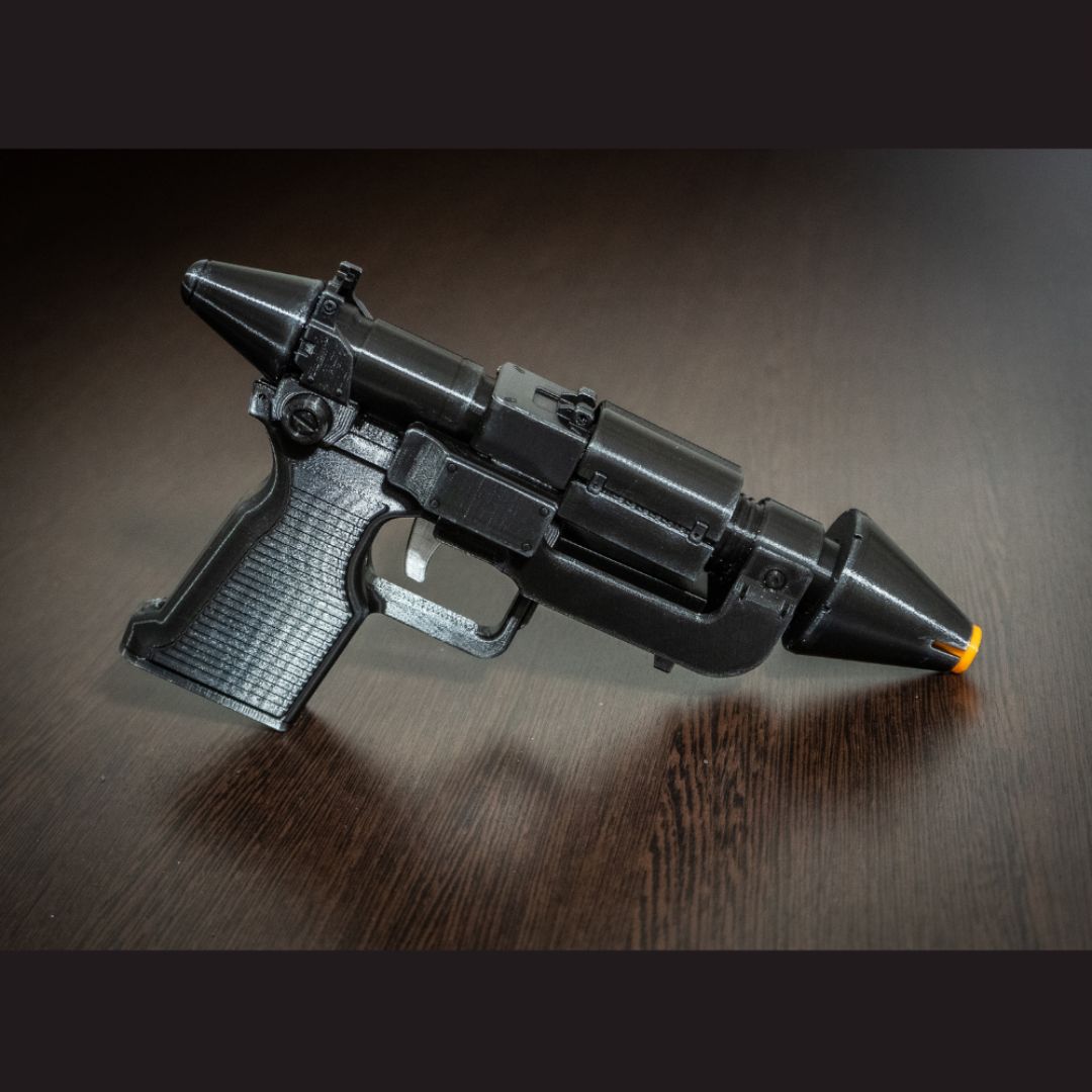 Admiral Thrawn RK-3 blaster pistol replica with orange safety tip on wooden surface for Star Wars cosplay and collection