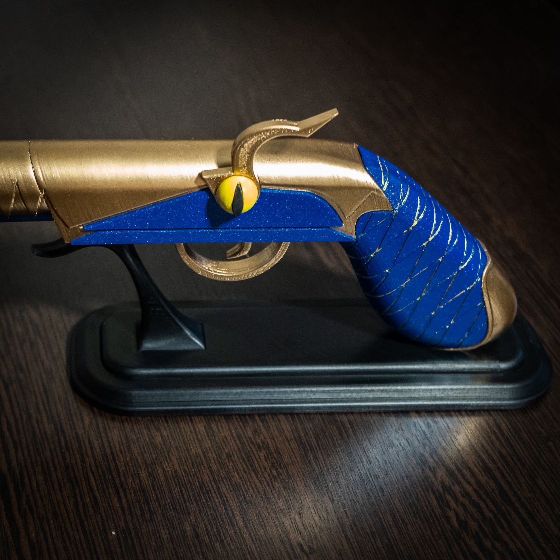 Side view of Blitzo’s cosplay gun – red and black cosplay blaster