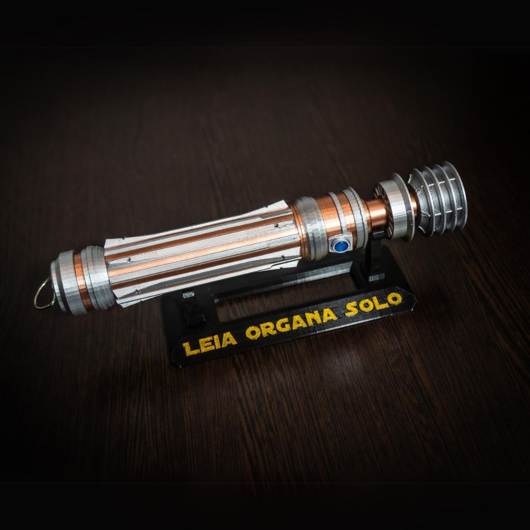 Leia Organa Lightsaber replica prop from Star Wars IX Rise of Skywalker displayed on a stand