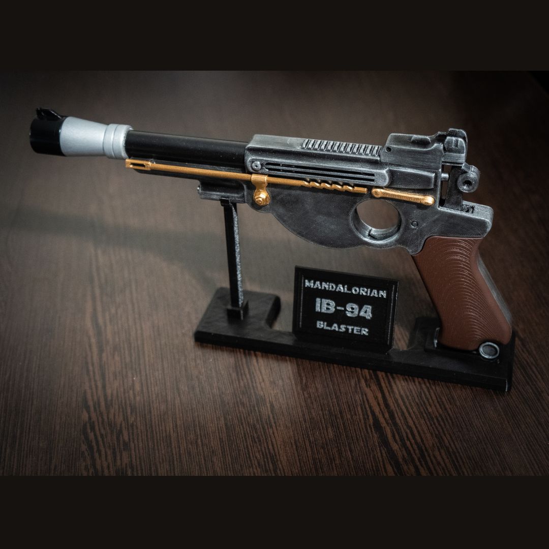 Mandalorian Blaster IB-94 Star Wars replica prop on display stand with realistic detail and orange safety tip