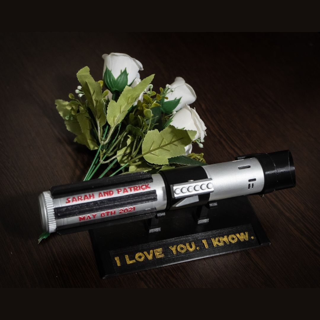 Star Wars inspired Darth Vader lightsaber bridal bouquet holder with custom engraved names and wedding date in black and silver design