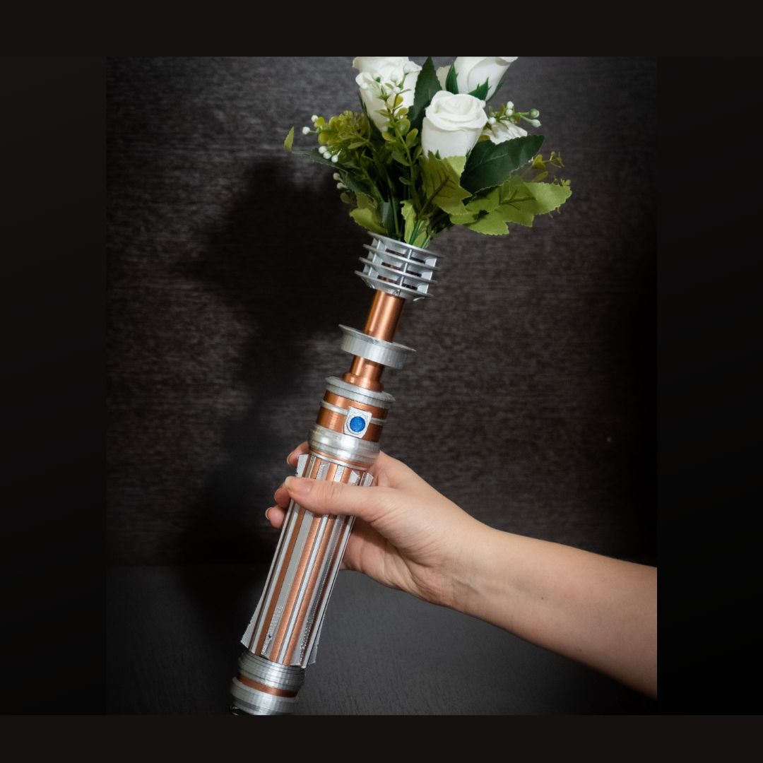 Star Wars inspired Leia lightsaber bridal bouquet holder in copper and chrome colors with white flowers