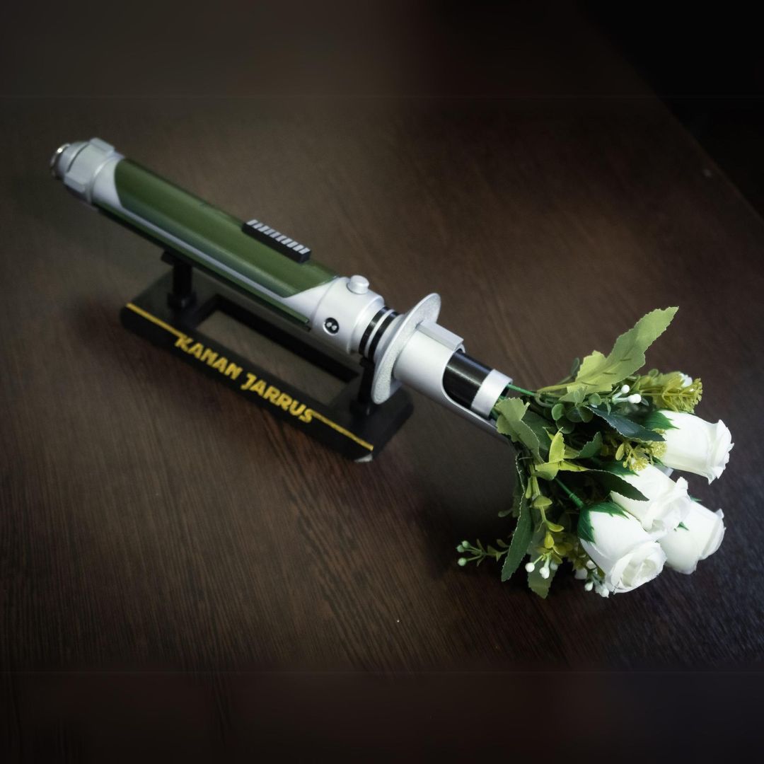 Star Wars inspired bridal bouquet holder shaped like Kanan Jarrus lightsaber with white roses