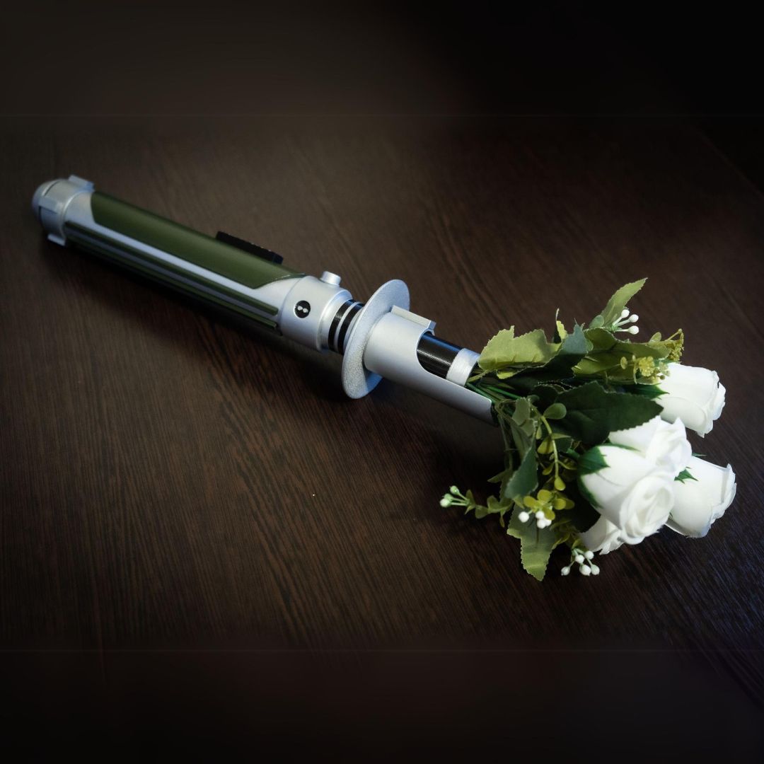 Star Wars inspired bridal bouquet holder designed as Kanan Jarrus lightsaber with white roses and green foliage