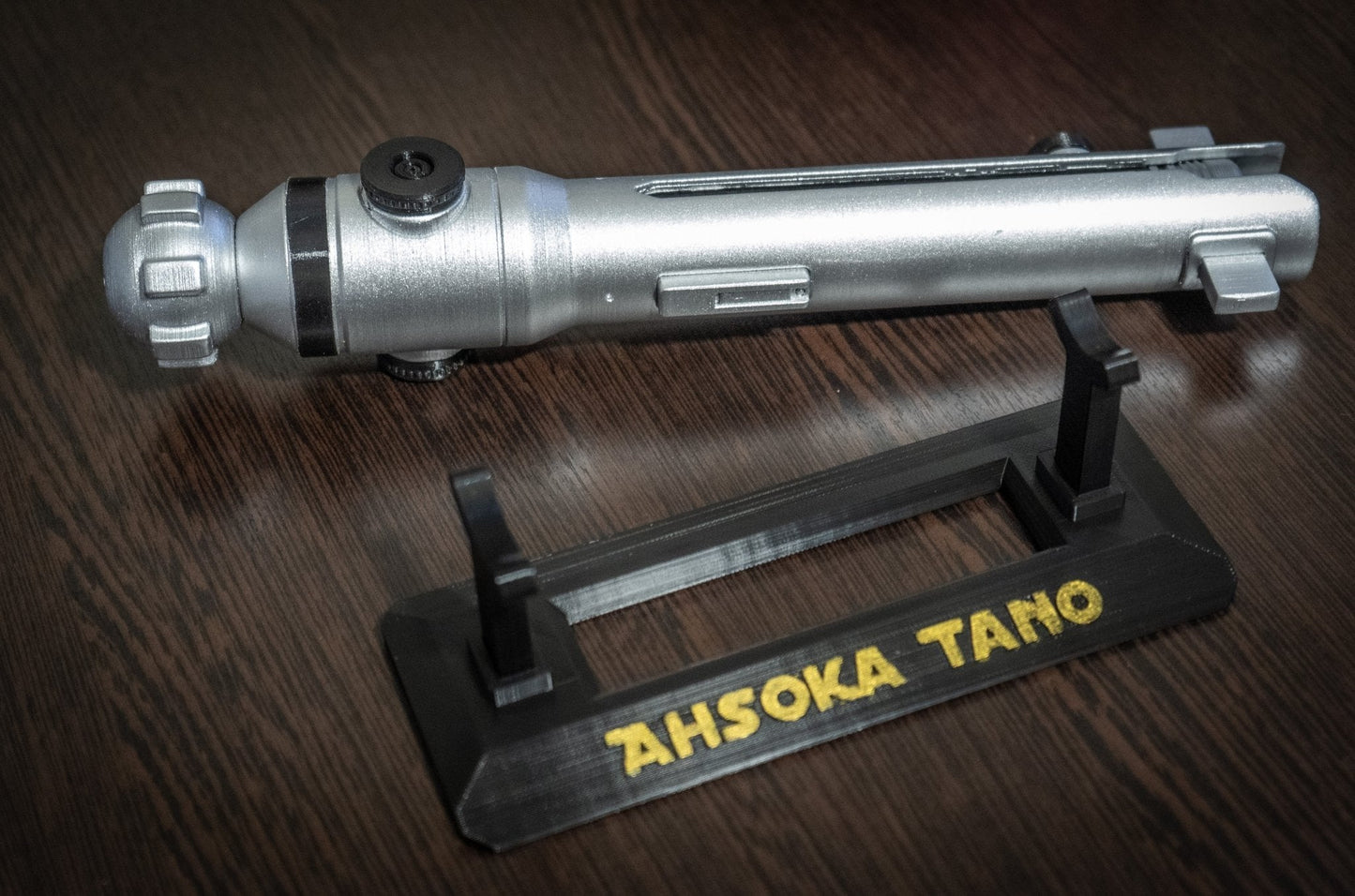 Ahsoka Tano lightsaber replica prop on stand with "Ahsoka Tano" text, star wars cosplay replica prop