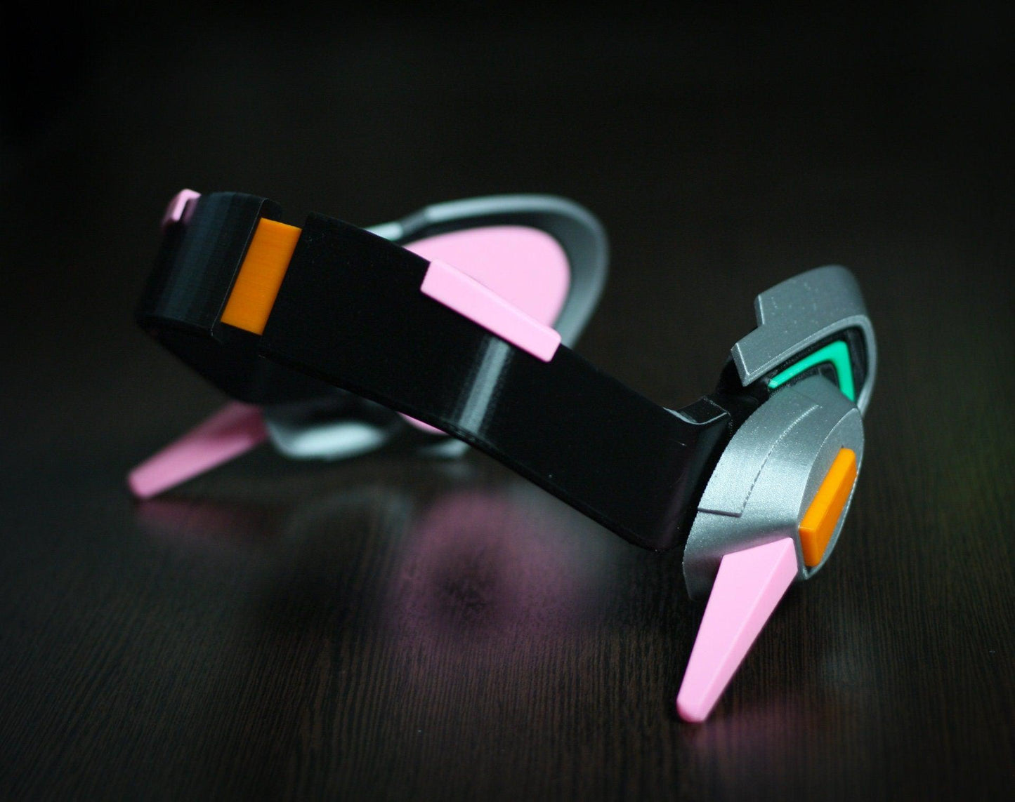 Officer Dva cosplay headset prop with black, pink, gray, and orange design for fans and cosplay enthusiasts