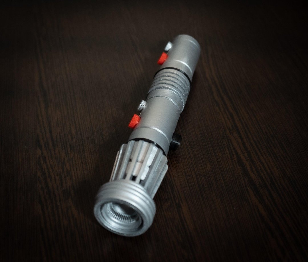 Darth Maul single-bladed lightsaber replica prop made of durable plastic, 10 inches long, perfect for Star Wars cosplay and collection.