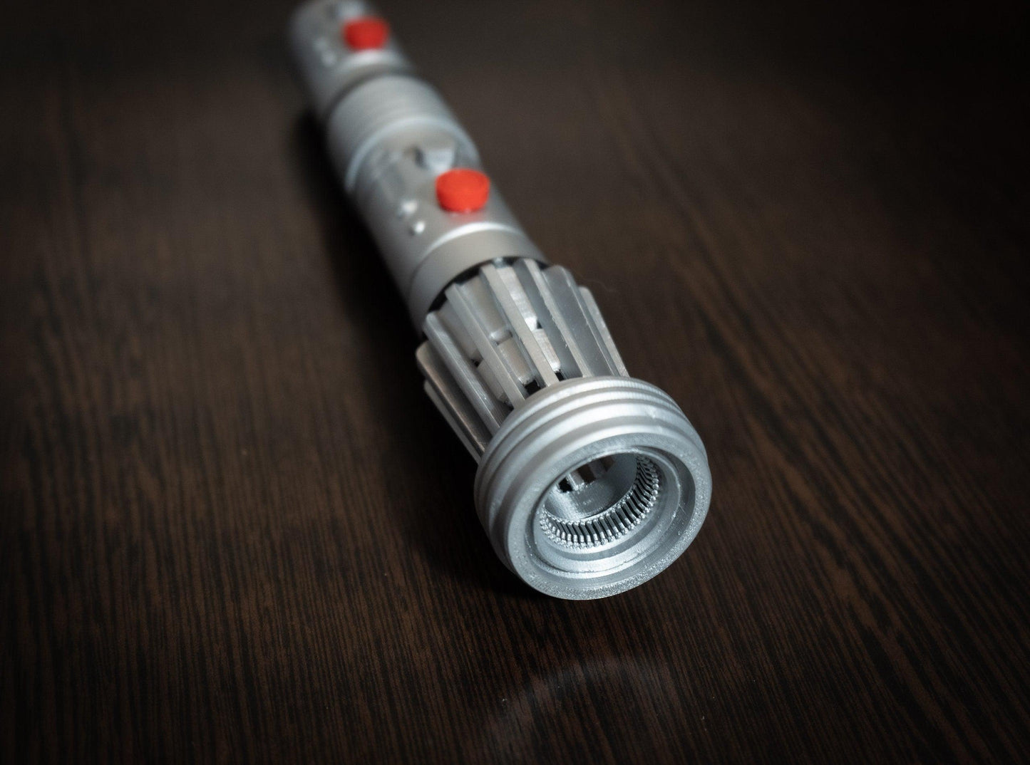 Darth Maul singlebladed lightsaber replica prop made of durable plastic with detailed hilt design for Star Wars cosplay and collectors.