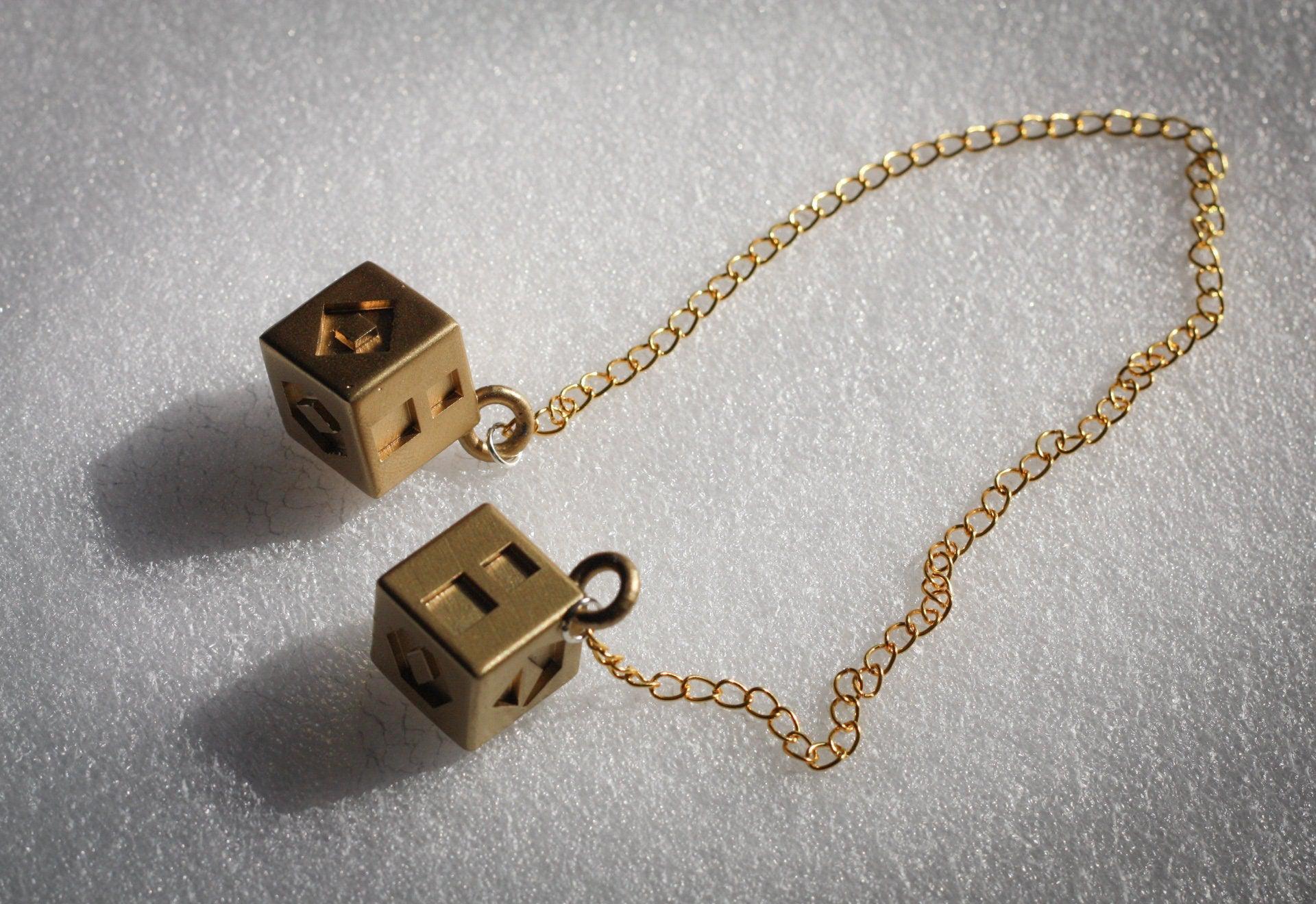 Han Solo's golden lucky dice replica with chain for Star Wars cosplay prop