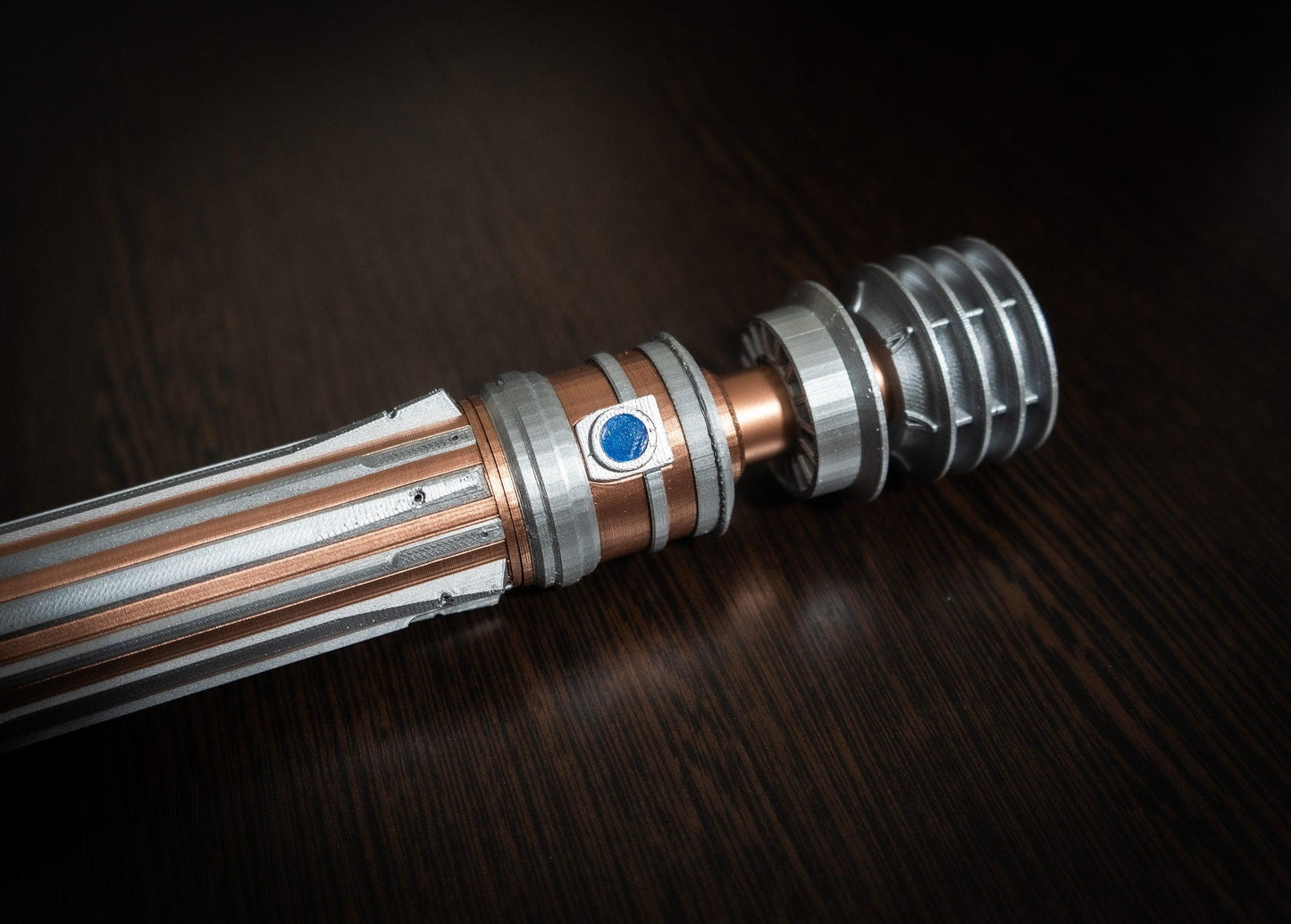 Replica of Leia Organa lightsaber from Star Wars IX Rise of Skywalker with detailed metallic design on dark background