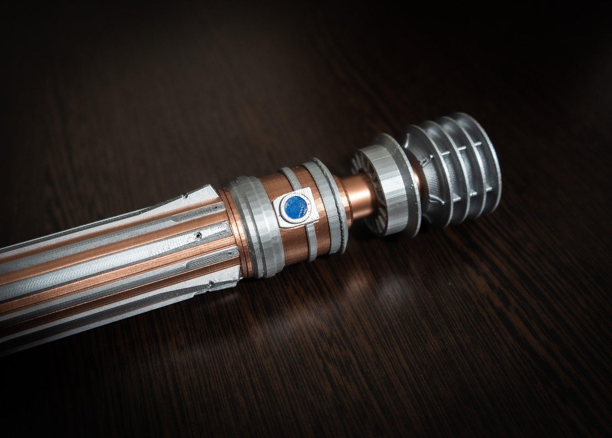 Replica of Leia Organa lightsaber from Star Wars IX Rise of Skywalker with detailed metallic design on dark background