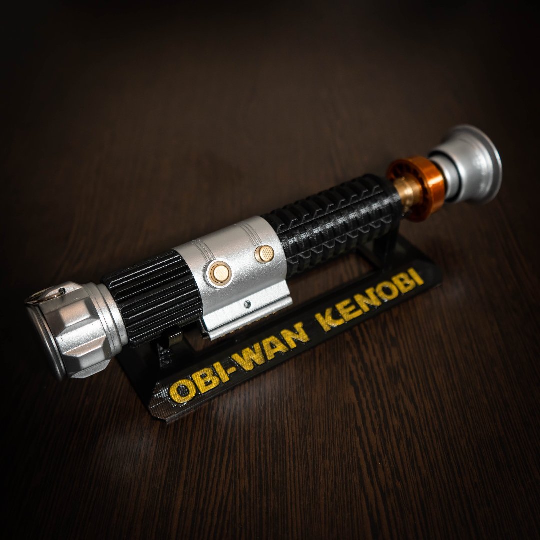 Obi-Wan Kenobi lightsaber replica from Star Wars A New Hope on display stand with detailed design