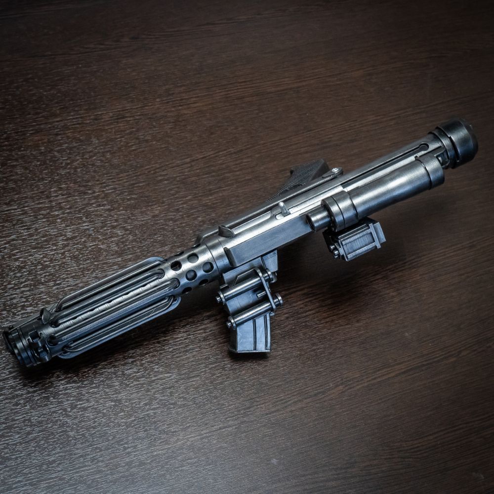 Silver toy gun on a wooden surface