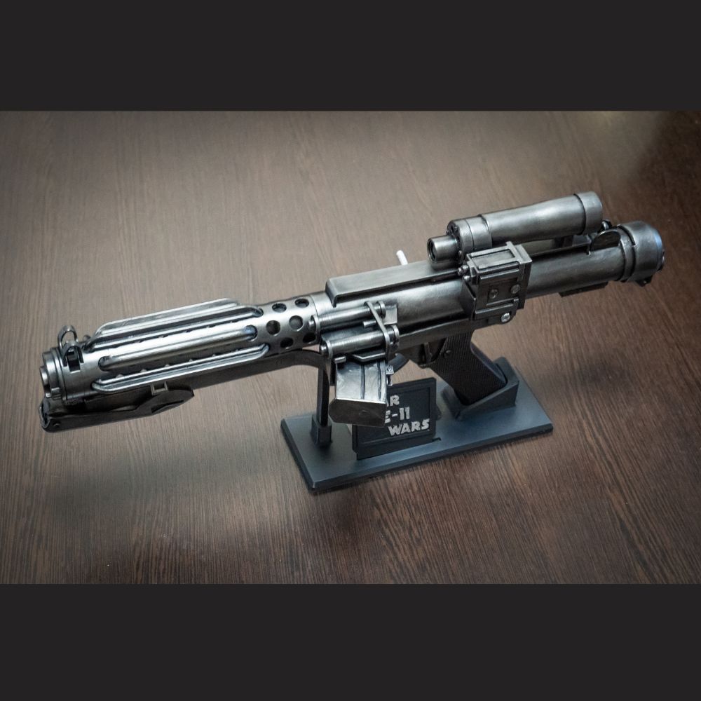 Model of a futuristic gun on a wooden surface